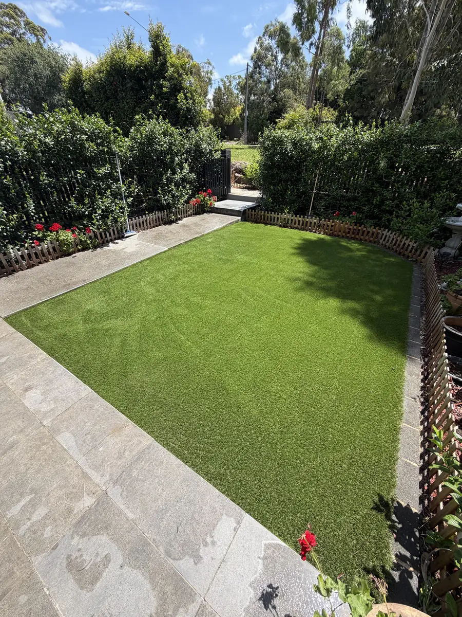 Artificial grass lawn in a fenced Sydney garden, installed by Turfland
