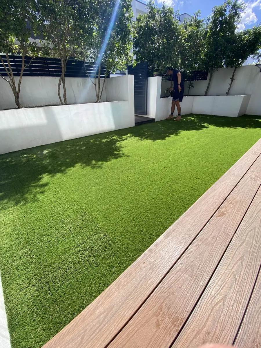 Artificial lawn next to a timber deck in a Sydney backyard